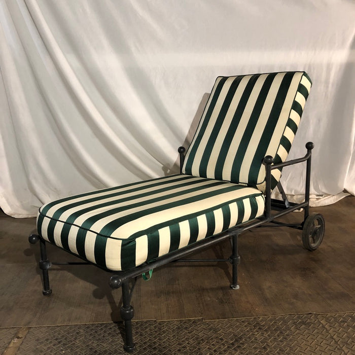 Black metal Chaise Lounge with green and white cushions