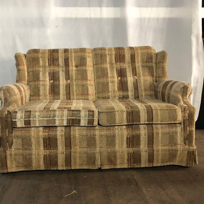 Tan and brown plaid couch
