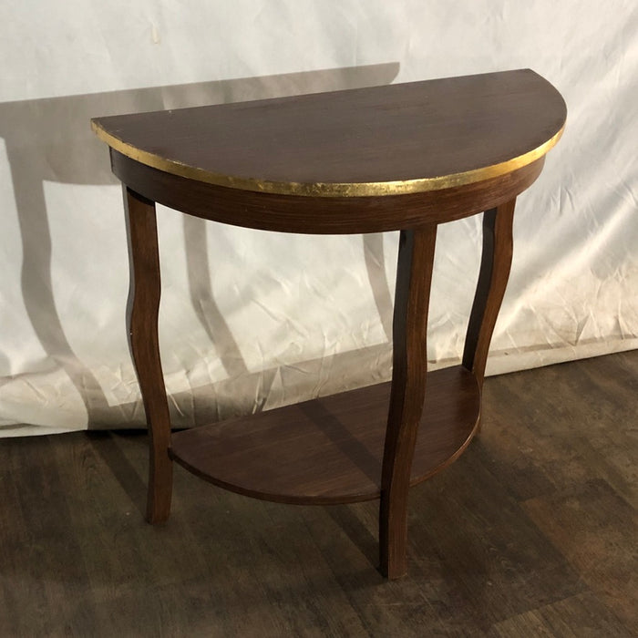 Half-moon Table with gold Edging.