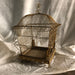 Golden Bird cage with lots of looping wireGold