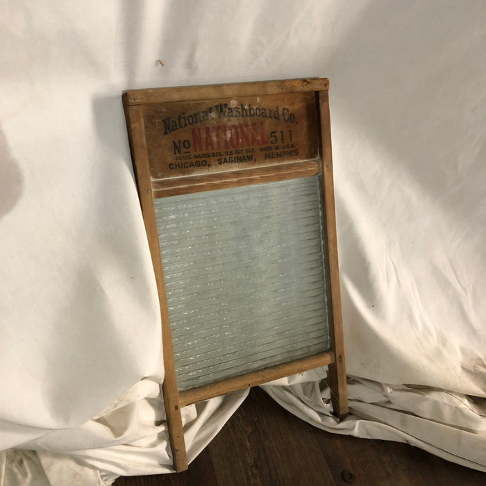  Vintage Washboard with a ribbed glass washing surface.
